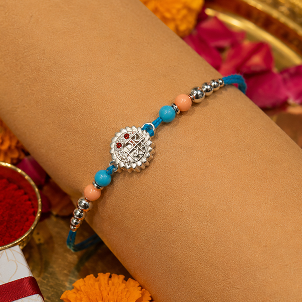 Silver Finish Bal Gopal Kids Rakhi with Blue & Peach Beads