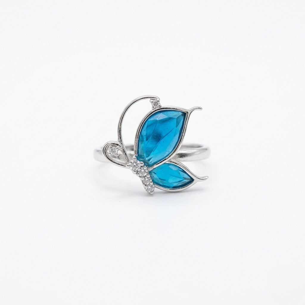 Close-up of a 925 butterfly silver ring featuring blue and white stones with white background