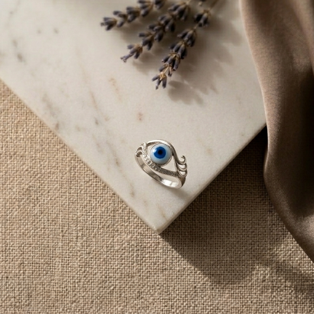 Top-down view of the Blue Evil Eye Silver Ring clearly highlighting its flowing, asymmetric silver design