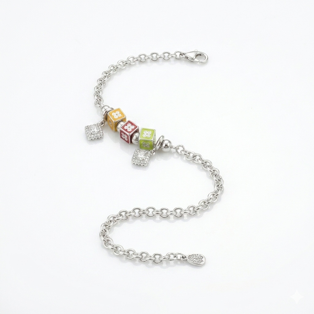 Studio shot of the Color Cube Charm Silver Bracelet on a white background, highlighting the rolo chain, lobster clasp, and intricate charms.