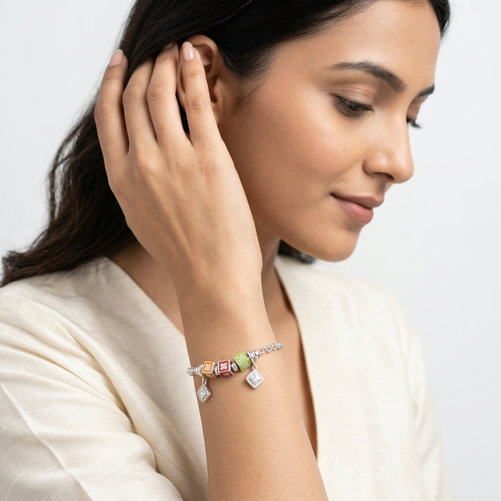 Close-up of a smiling woman touching her hair, showcasing the Color Cube Charm Silver Bracelet on her wrist.
