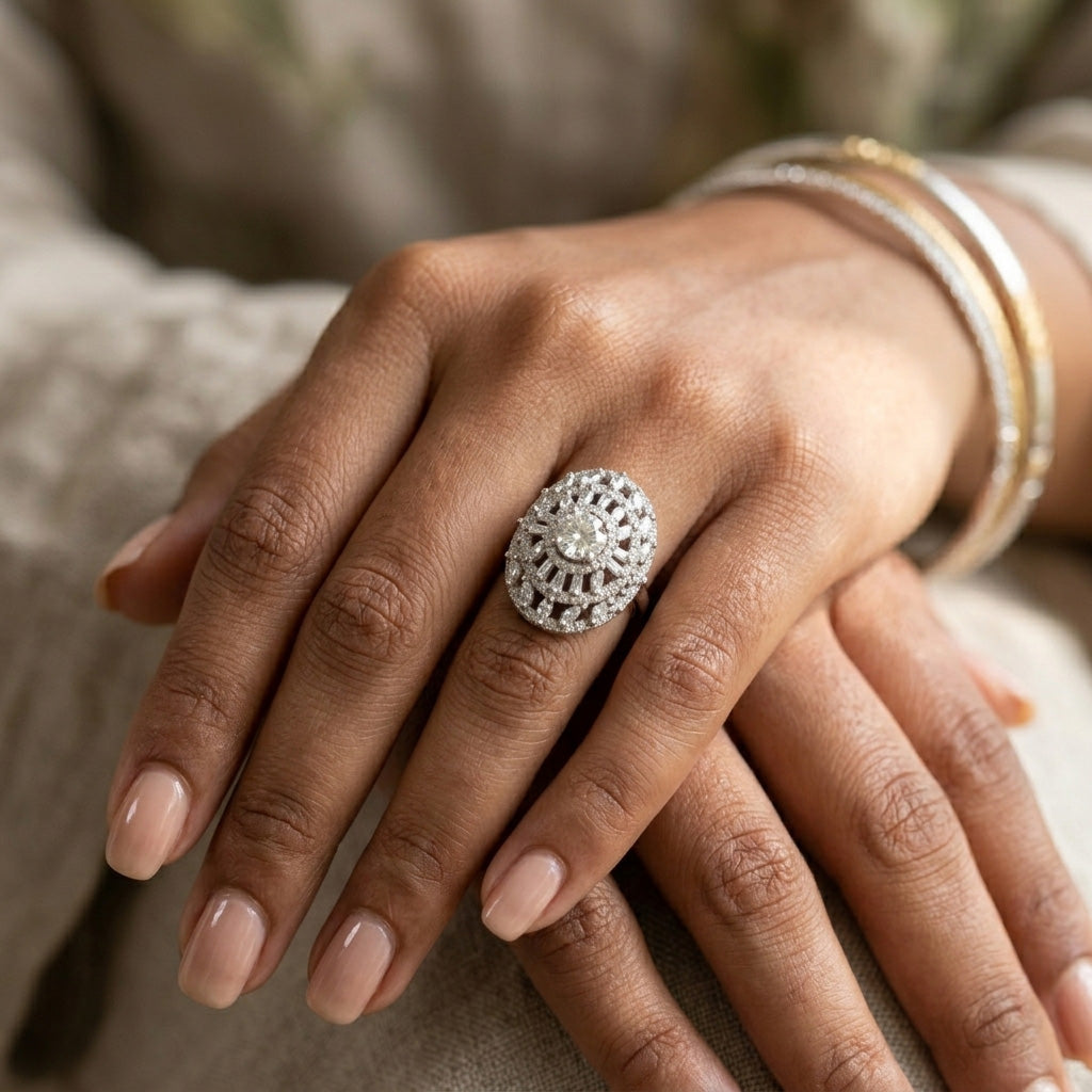 A woman wearing the Crown Design Silver Ring With Halo Statement Style on her hand, showcasing its elongated sunburst design and sparkling oversized face.