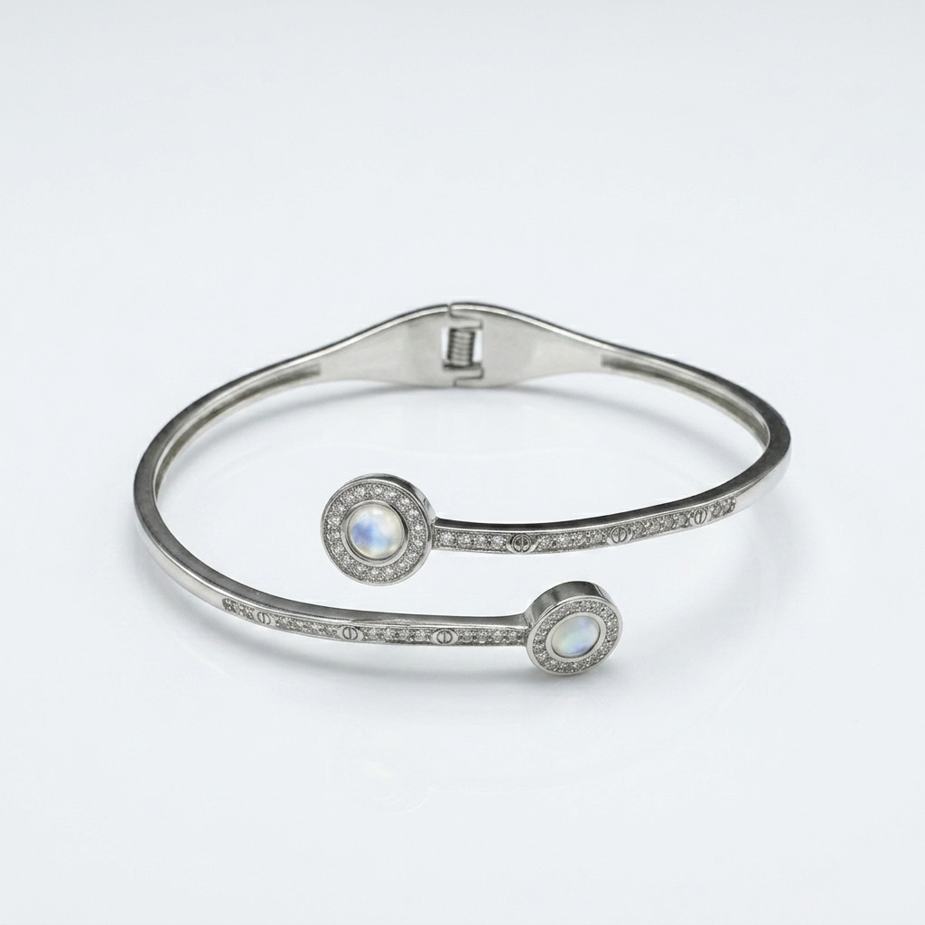Flat lay view of a Dual Circle Silver Open Kada displaying the bypass design and dual crystal-encrusted moonstone circles.