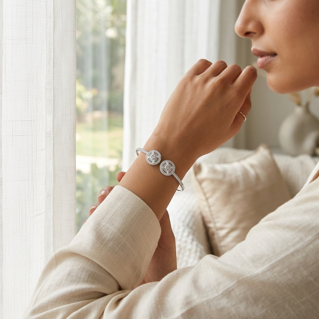 Close-up of a woman indoors resting her hand, highlighting the elegant fit of the Dual Circle Silver Open Kada