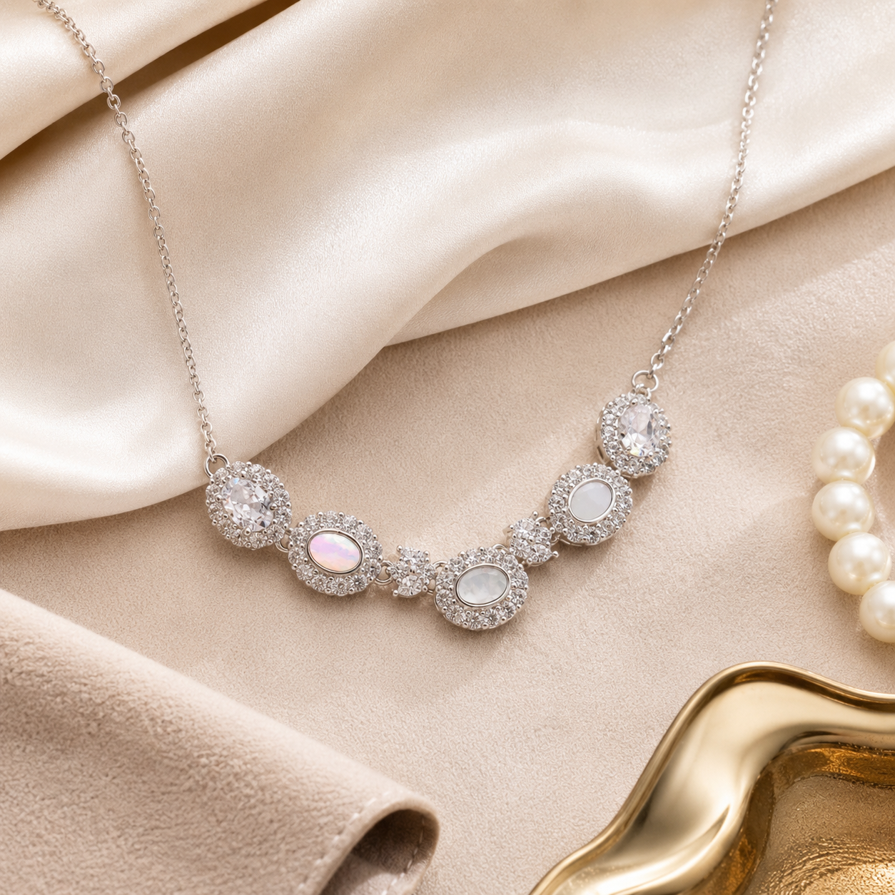 Close-up of the delicate sterling silver cable chain and sparkling halo-set crystal clusters.