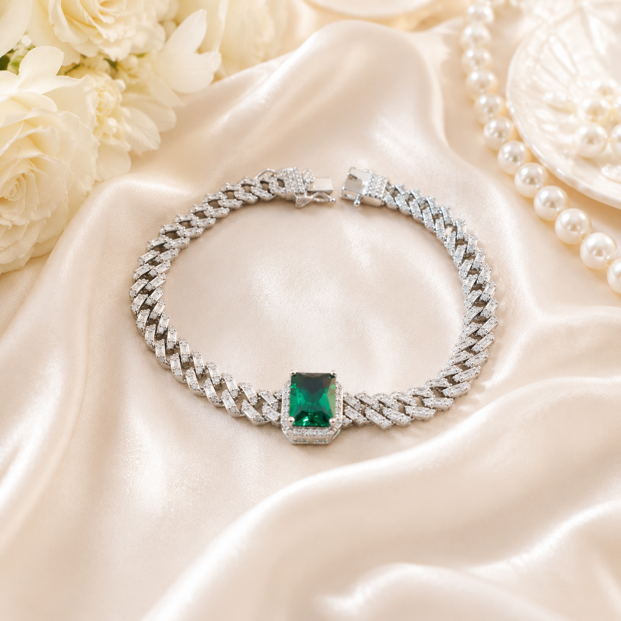 Detailed view of the secure box clasp and interlocking Cuban links on a green crystal bracelet