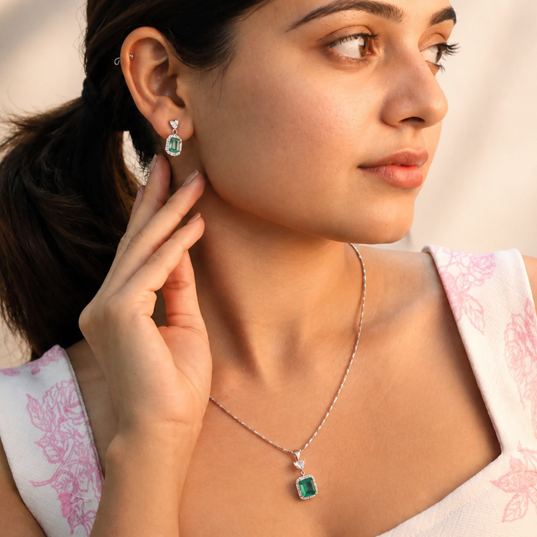 Elegant drop earrings and pendant set featuring green emerald-cut stones