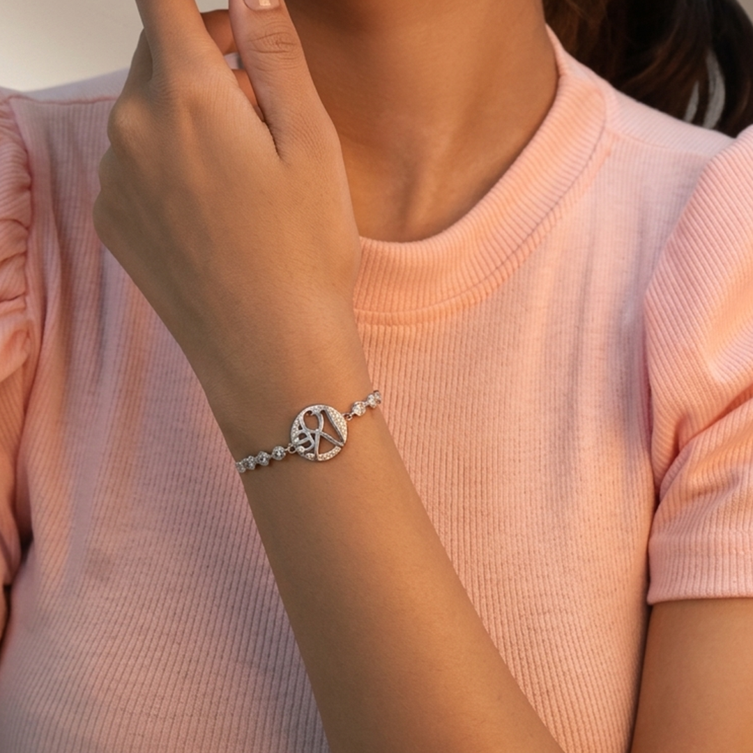 Detail of the adjustable extension chain and geometric center motif on the silver bracelet