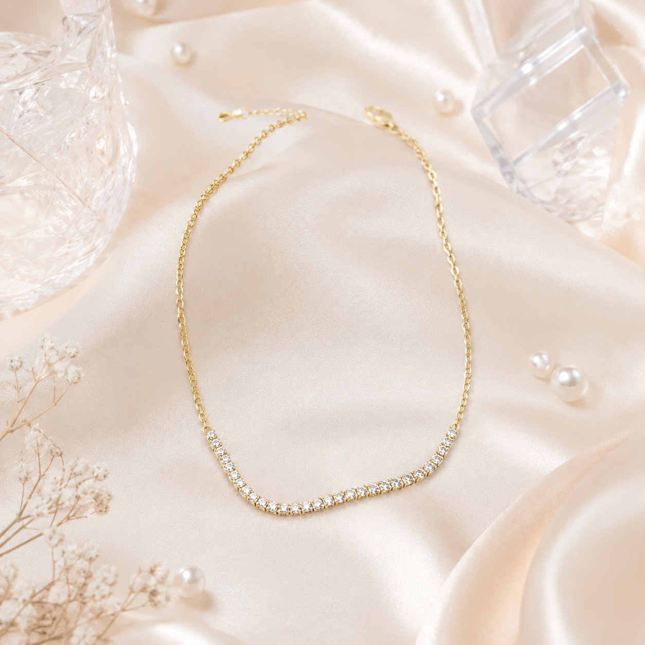 Top view of a silver-tone stone-studded tennis anklet with an adjustable extension chain