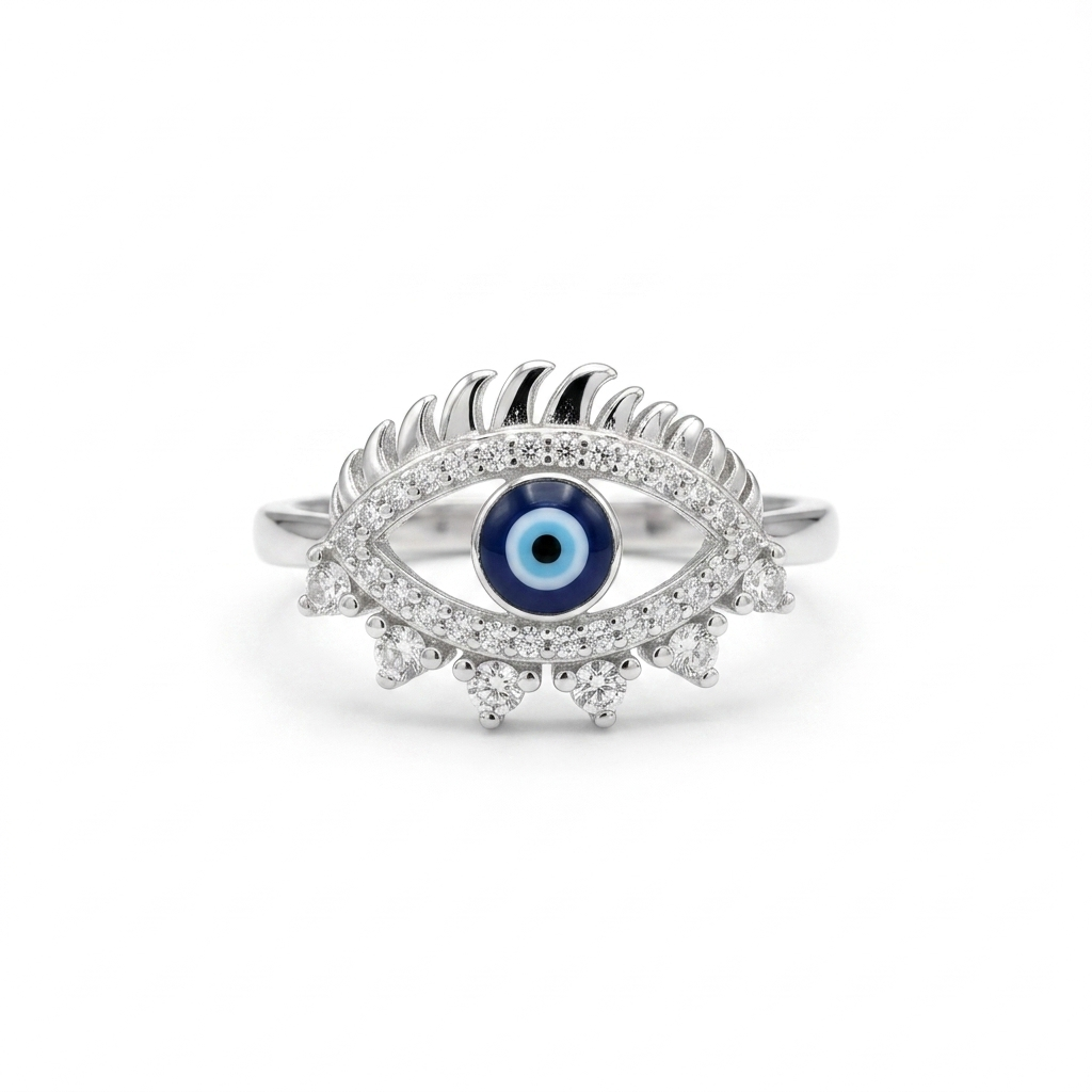 Front-facing studio shot of the Good Luck Silver Ring highlighting the blue eye center, sweeping top lashes, and lower cubic zirconia accents.