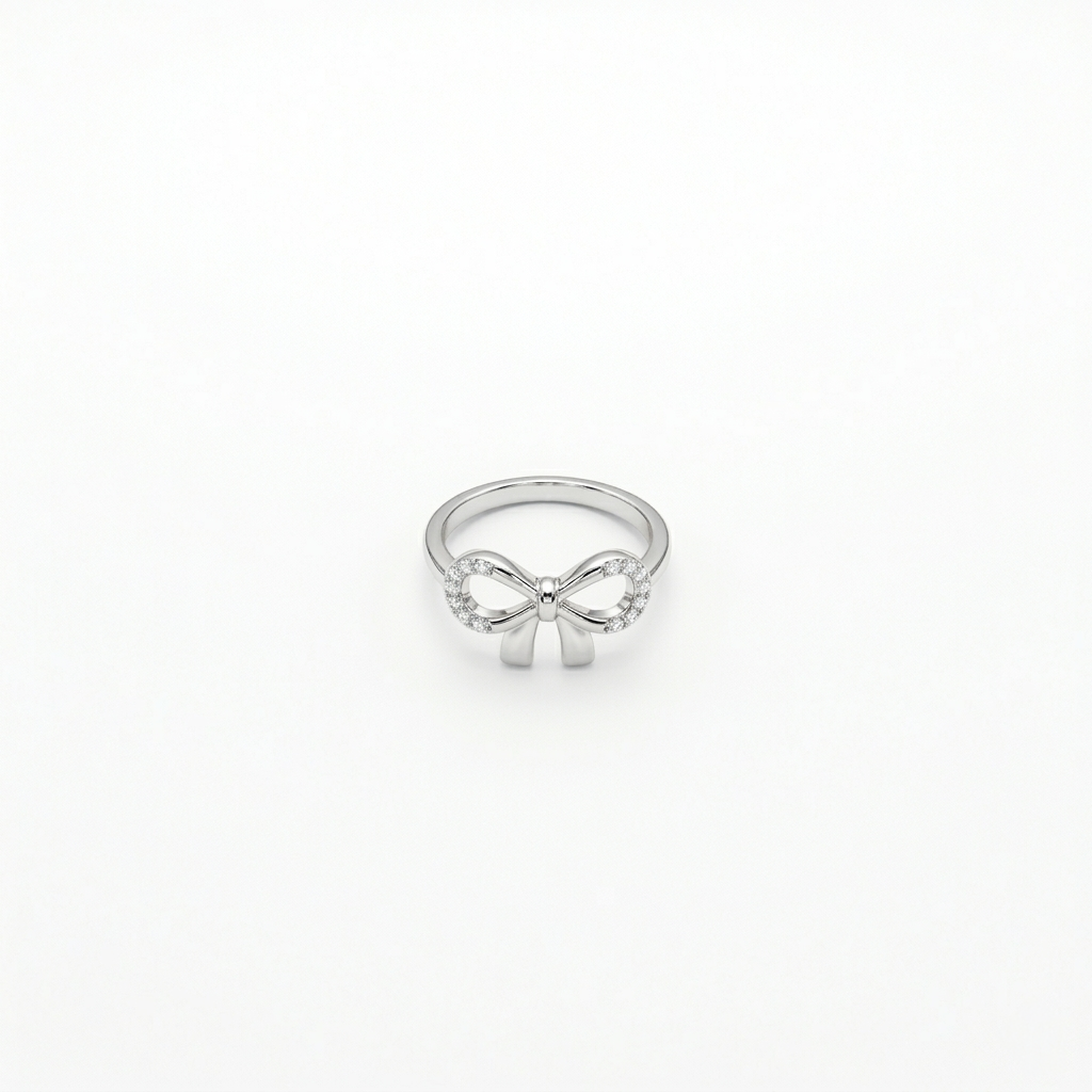Studio shot of the Infinity Bow Silver Ring resting directly on a plain white background.