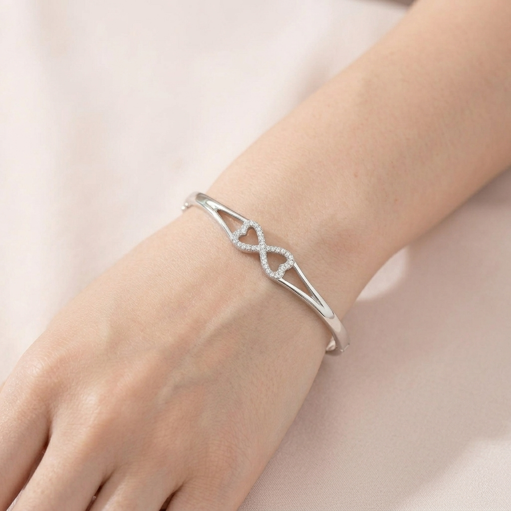 Infinity Design Silver Bracelet worn on a woman's wrist showing the split shank design