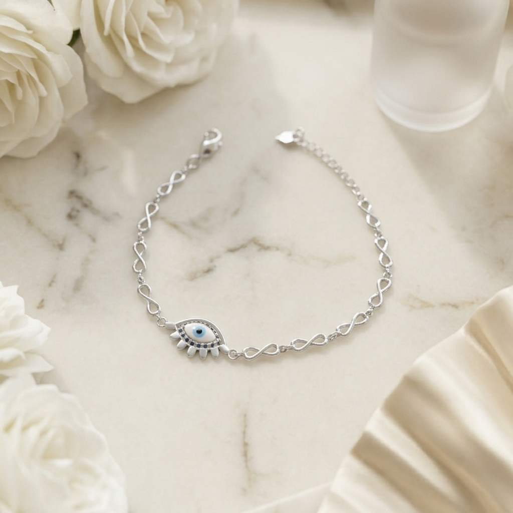 Close up view of the silver infinity links and adjustable lobster clasp on the bracelet