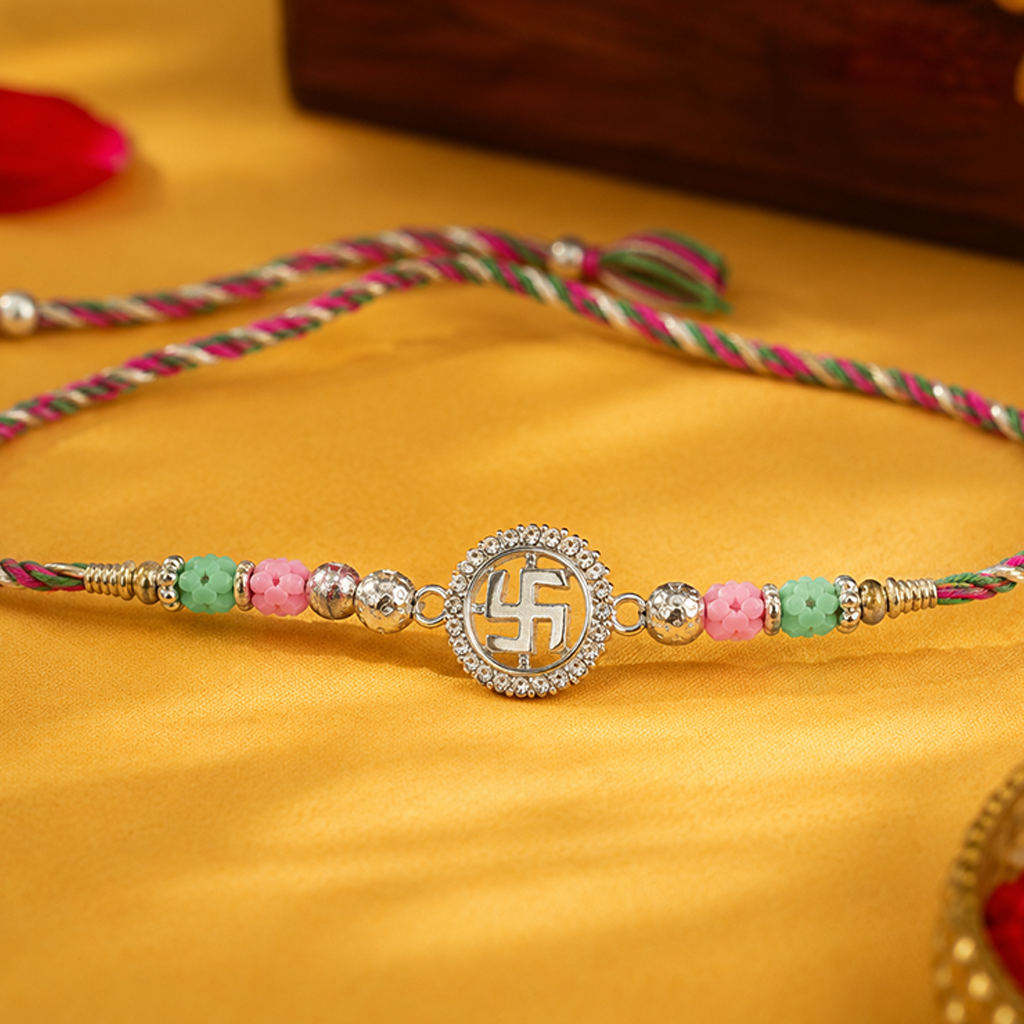 Sacred Swastik Silver Rakhi with Pastel Beads