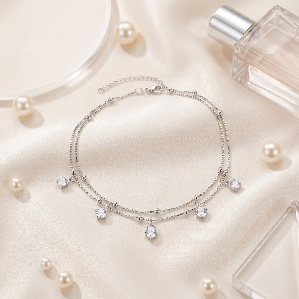 Delicate two-strand silver anklet with adjustable lobster clasp and crystal drops