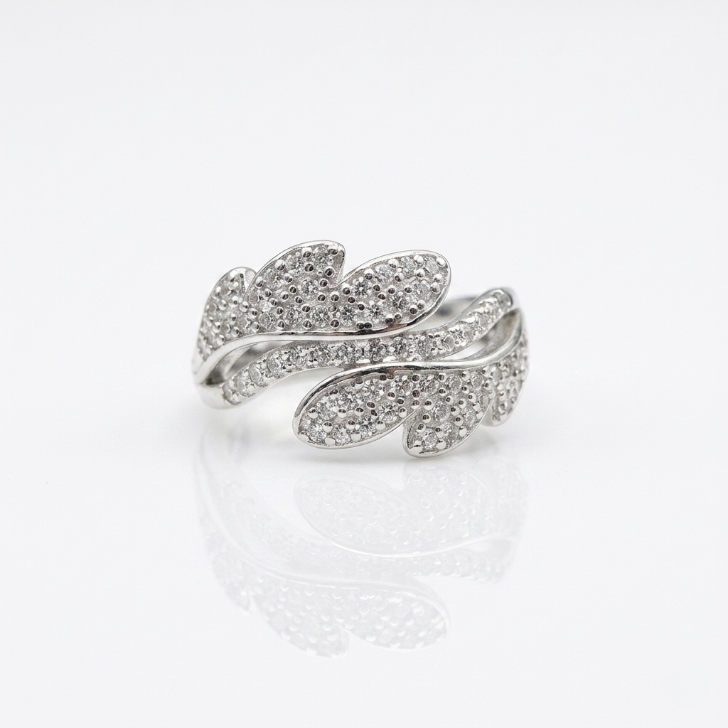 Detailed front view of the Leaf design Silver Ring on a pure white reflective surface