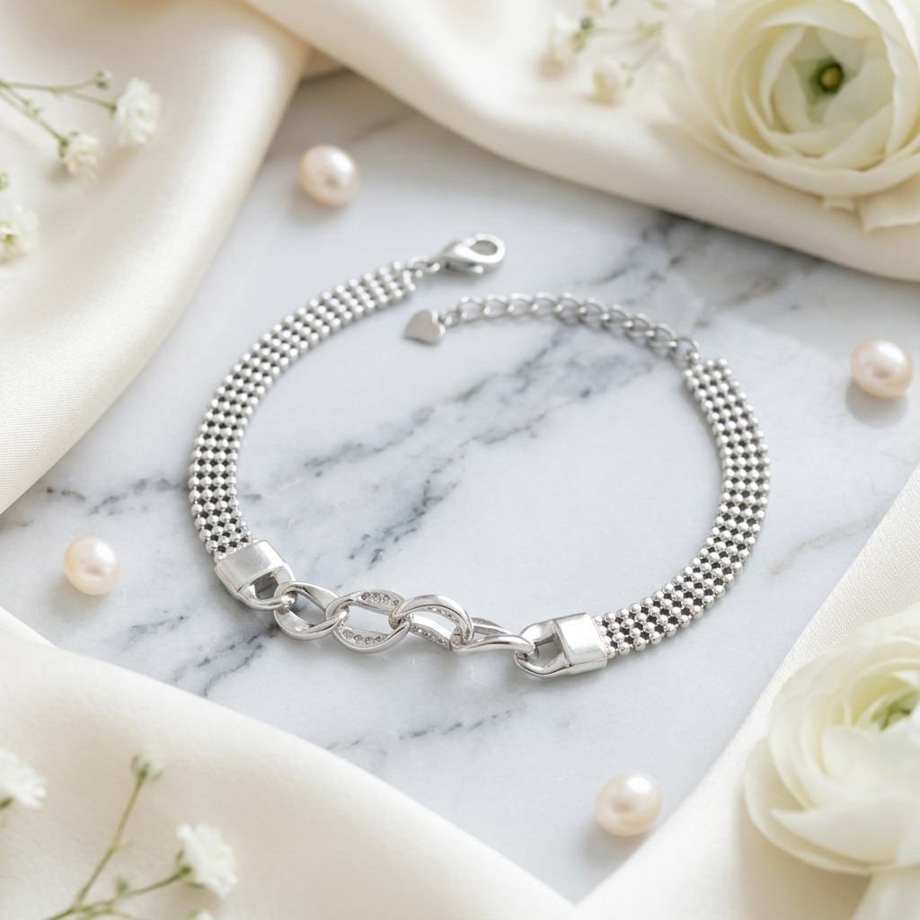 Close-up view of the silver bracelet showcasing the interlocking chunky curb links and detailed mesh chain