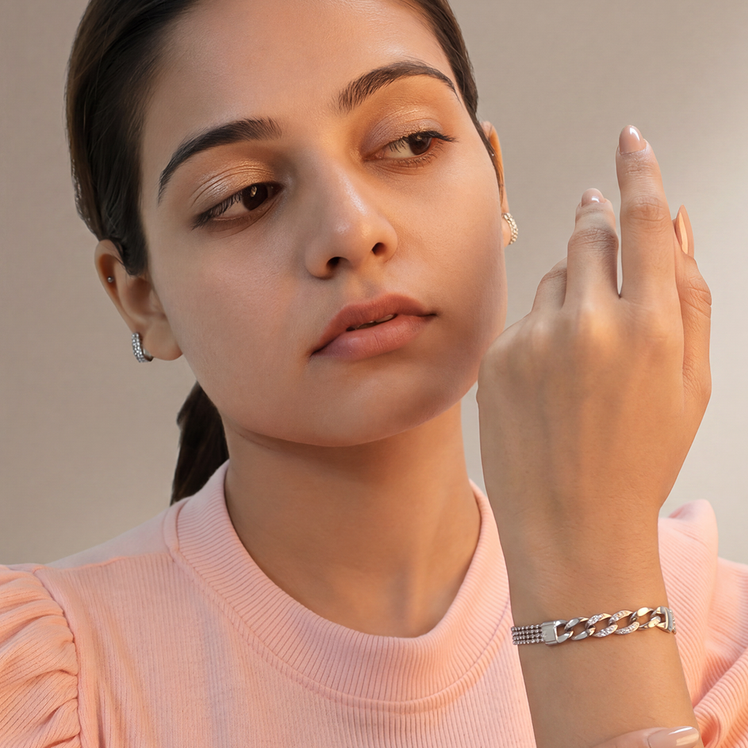 Elegant silver mesh and curb link statement bracelet displayed beautifully on a marble background