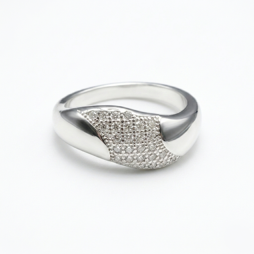 Studio shot of the asymmetrical Party wear silver ring featuring a dense pavé stone center on a plain white background
