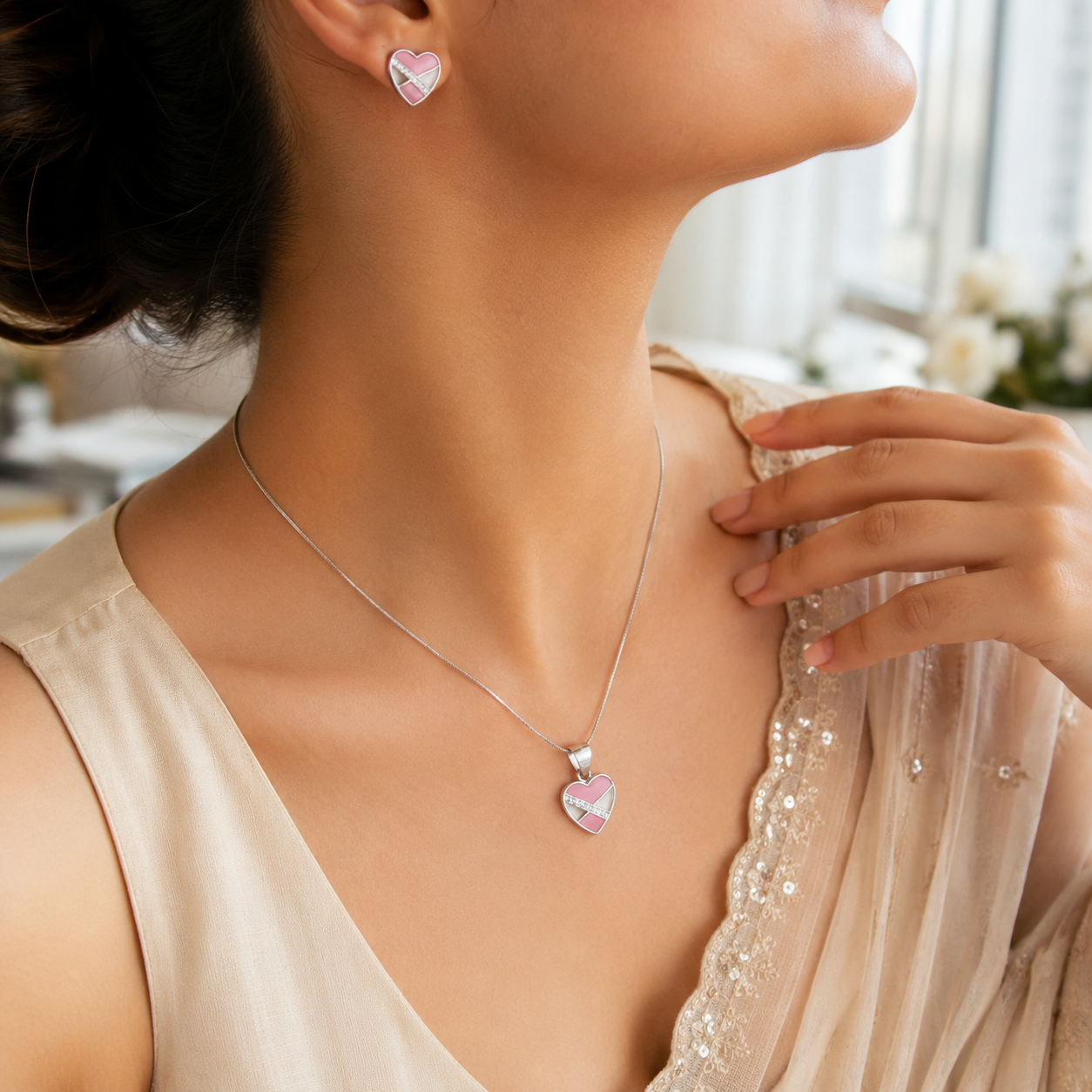 Matching pink enamel and silver heart stud earrings with cubic zirconia accents