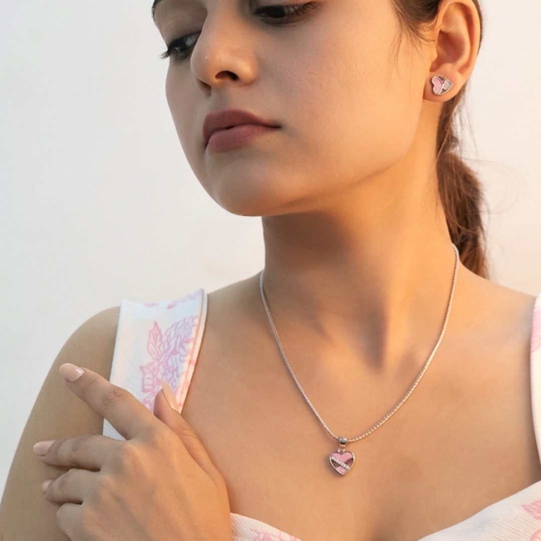 Complete three-piece jewelry set featuring a silver heart pendant and two earrings