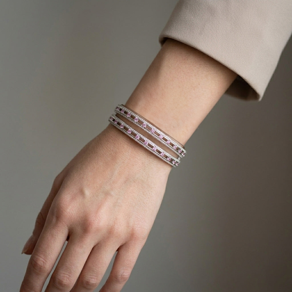 Female wearing a pink stone silver bracelet with corporate look