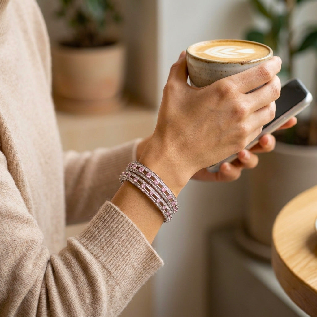 A picture showing pink stone silver bangle worn as an everyday casual accessory