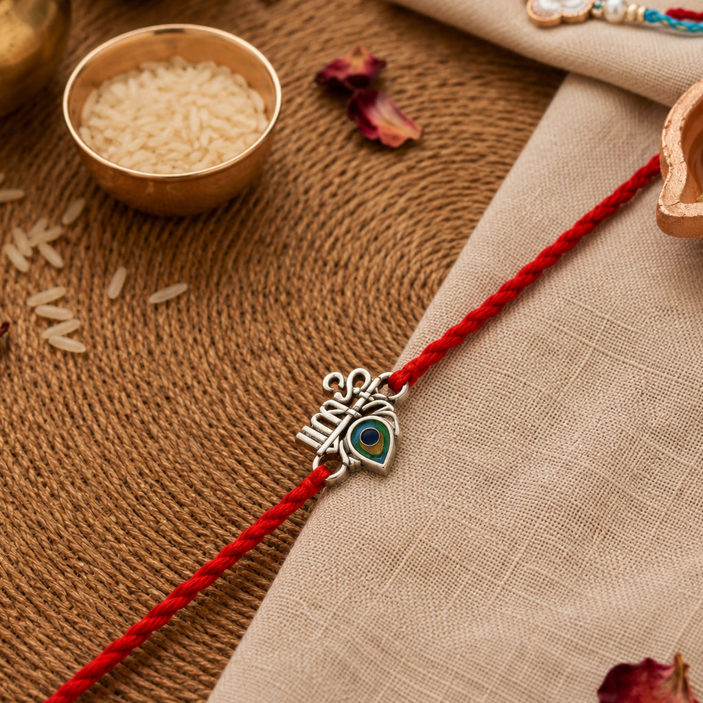 Silver Om Peacock Feather Rakhi