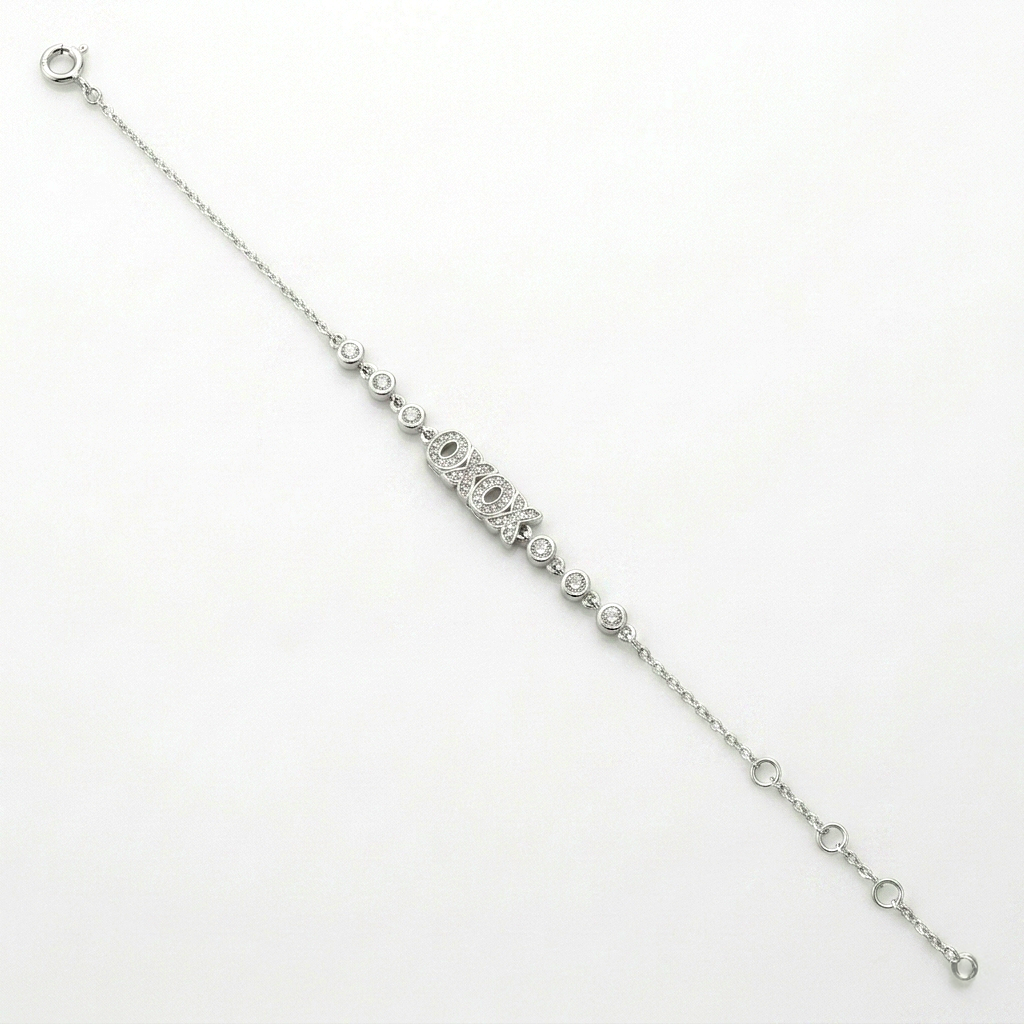 Full length view of the Raksha Sutra Owl Silver Bracelet with OXOX centerpiece and spring ring clasp on a white background.
