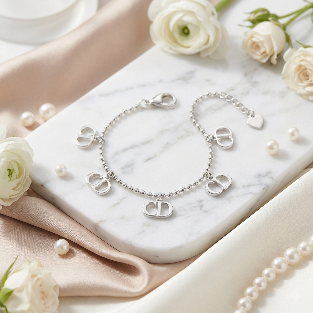 Close-up of the silver bracelet's lobster clasp and adjustable extension chain