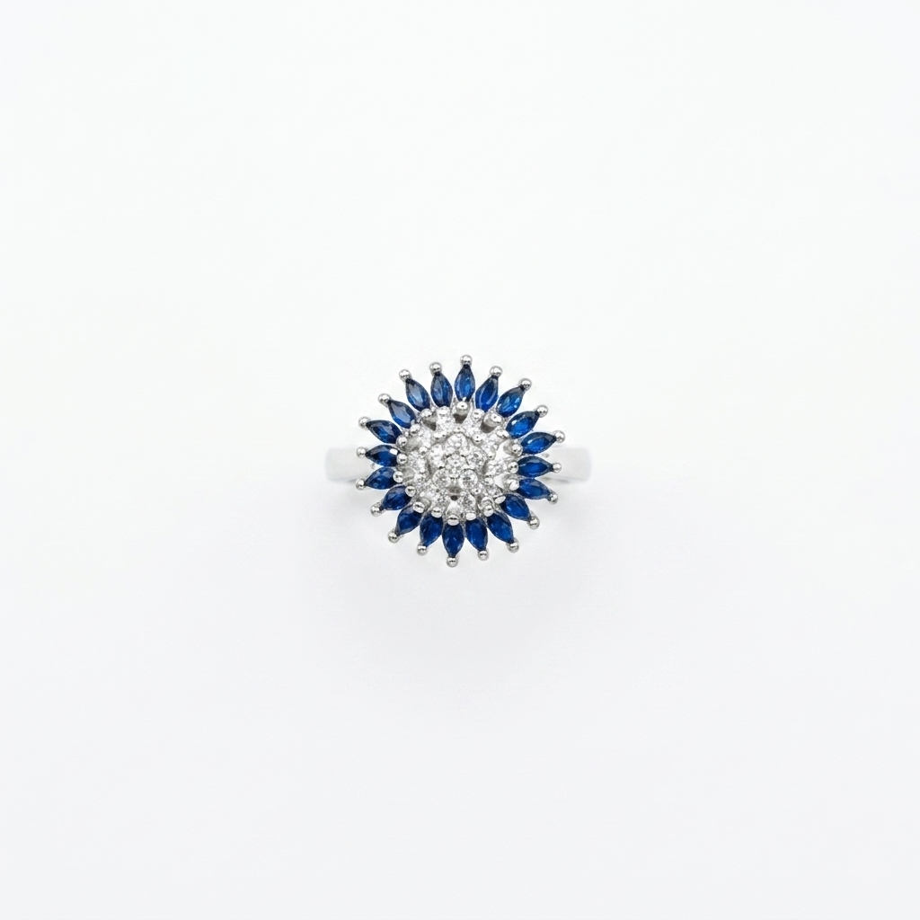 Top-down view of a Silver Blue Stone Ring featuring a cluster of white center stones surrounded by blue marquise stones on a white background