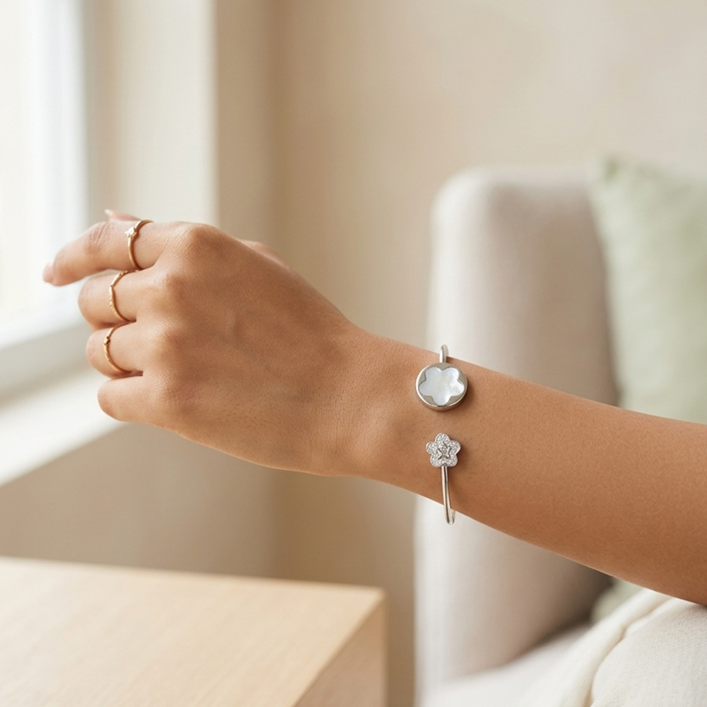 Woman wearing a Silver Floral Open Kada for Women with a mother-of-pearl flower and stone-studded floral end