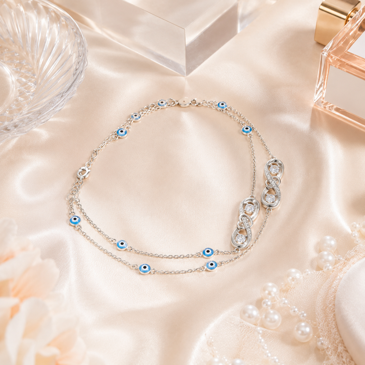 Detailed view of the sparkling cubic zirconia infinity charm and blue evil eye beads
