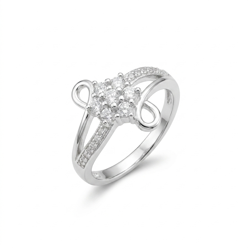 Isolated product shot of the Silver Infinity Swirl Crystal Ring with a seven-stone crystal center and asymmetrical open loop against a white background.