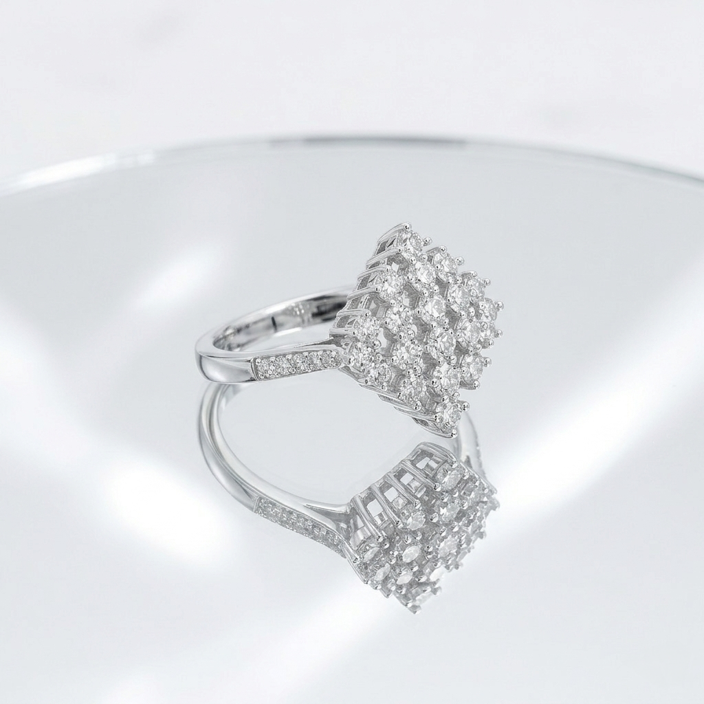 Close-up profile view of the Silver Rhombus Cluster Ring resting on a mirror-like reflective surface, highlighting its raised basket setting.
