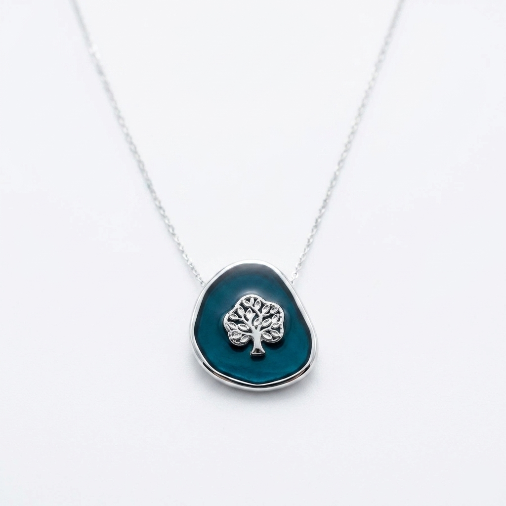 Detailed product shot of the Silver Tree of Life Black Enamel Pendant Necklace on a clean white background showcasing the cable chain and motif