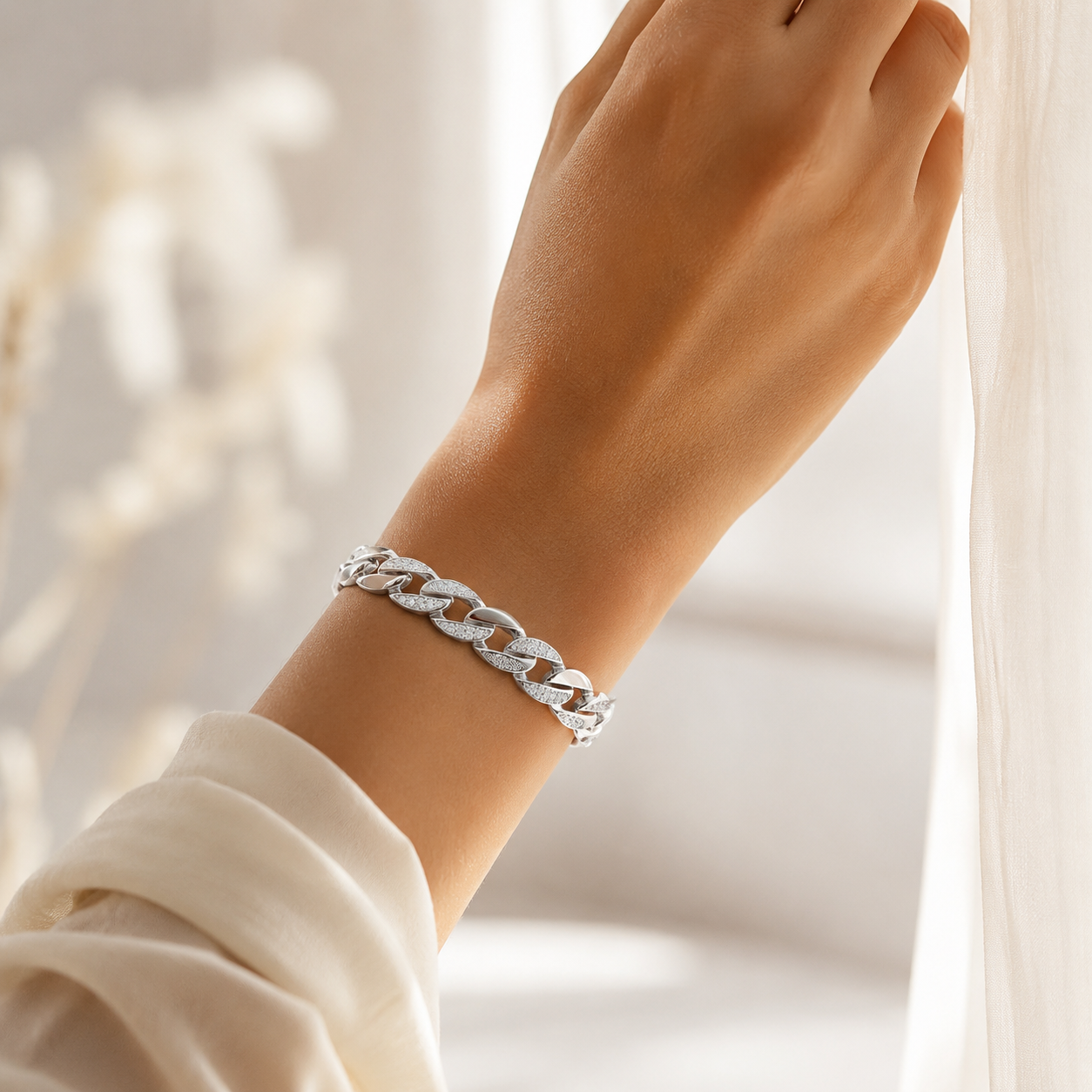 Top view of the silver bangle highlighting the brilliant cubic zirconia stones