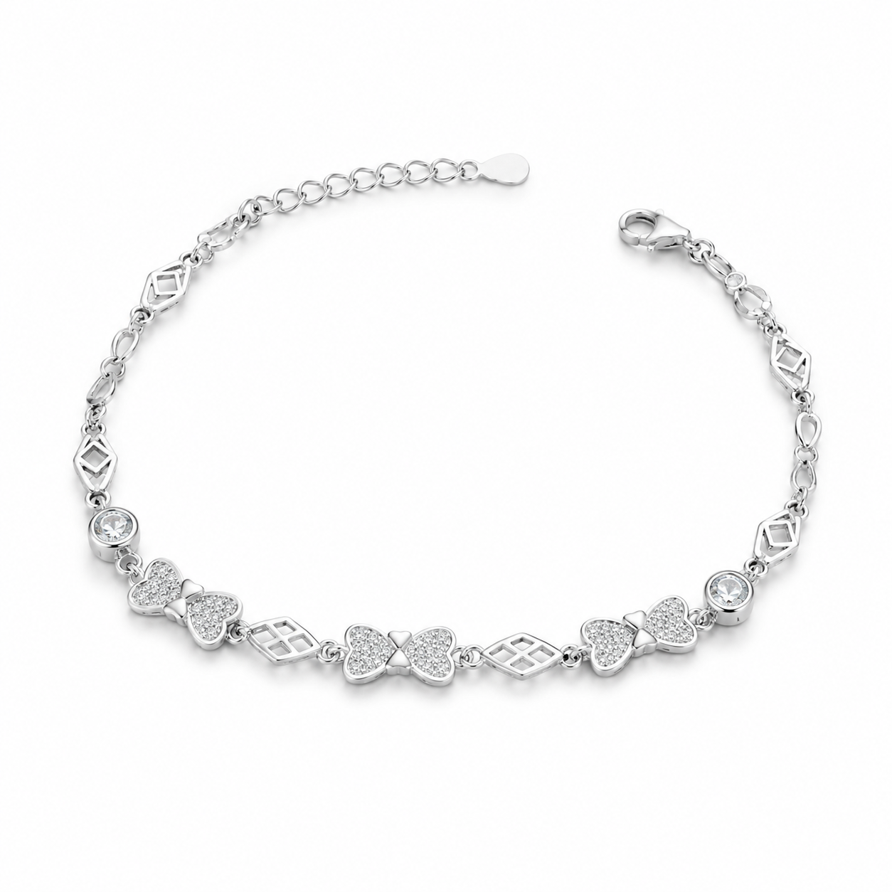 Sparkling silver bracelet featuring delicate pavé bow links on a white background.