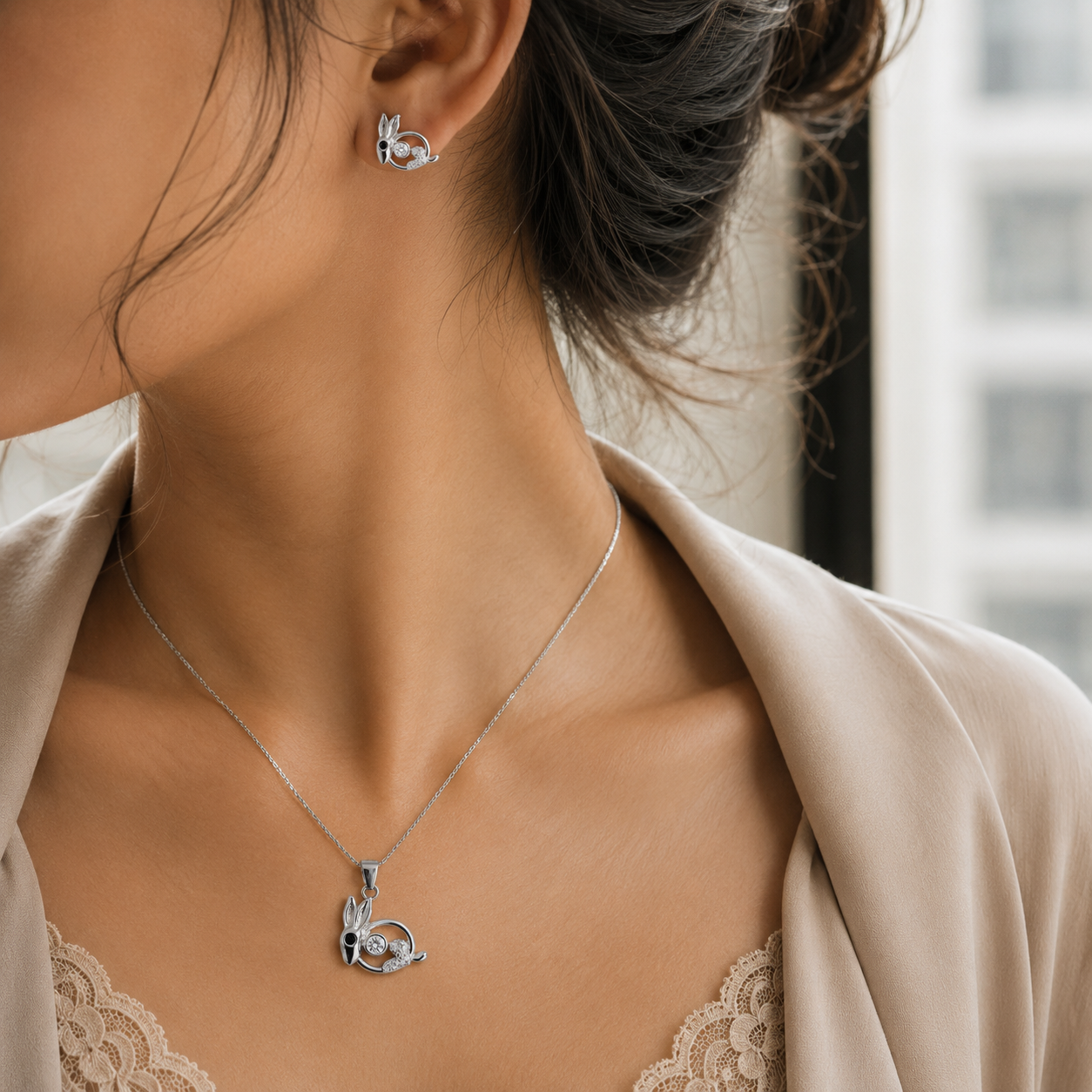Three-piece sterling silver jewelry set featuring bunny rabbit designs with a prominent sparkling belly stone.