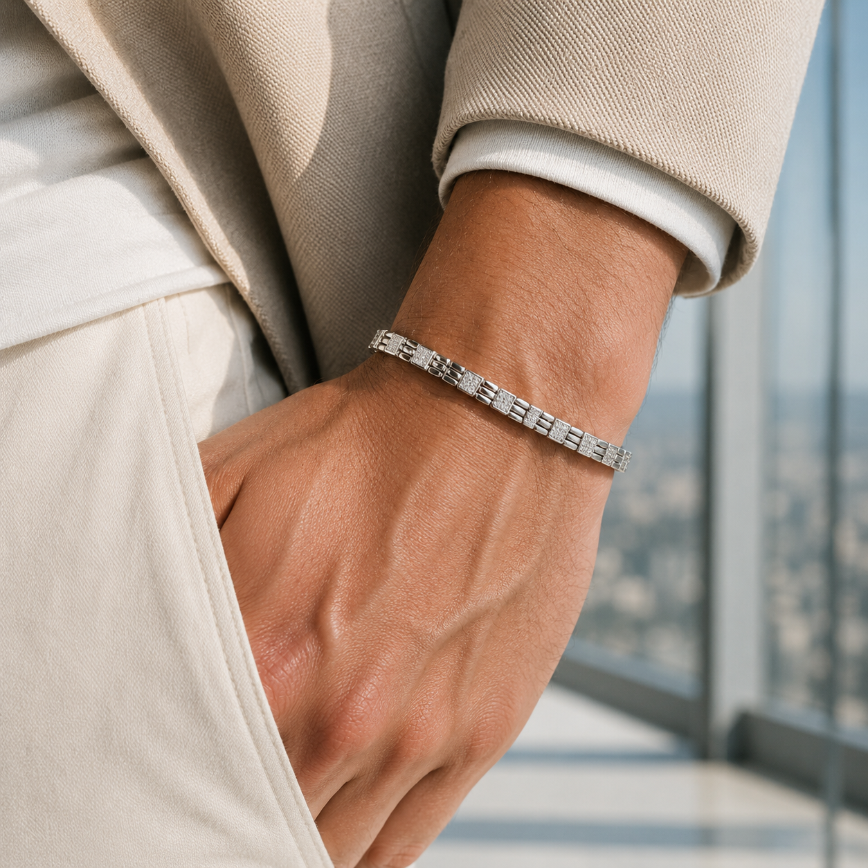 Angled view of the men's crystal-studded silver bracelet highlighting the secure box clasp mechanism.