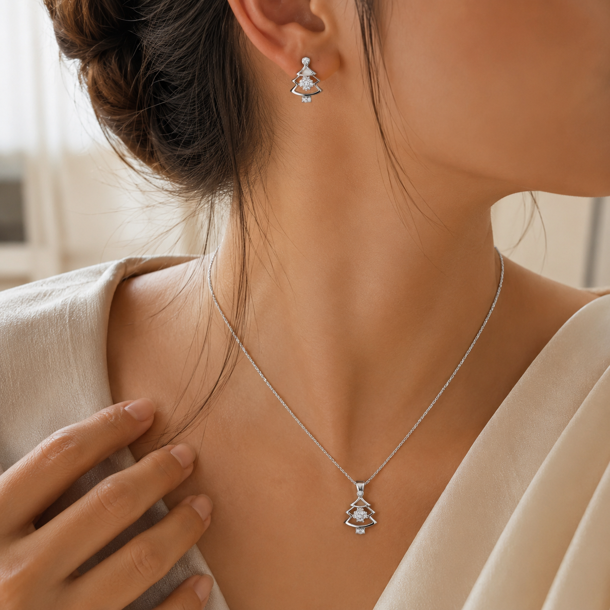 Front view of the matching holiday-themed silver earrings and pendant