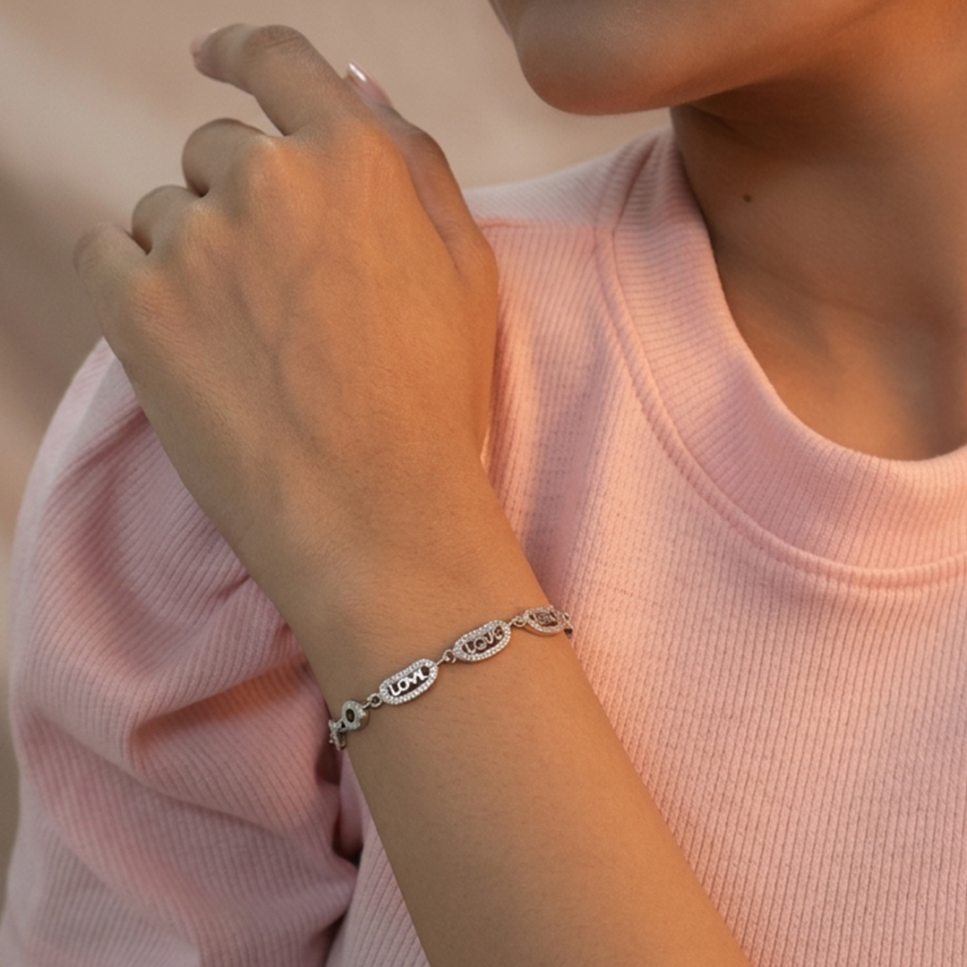 Full view of the Sterling Silver Love Link Bracelet highlighting the circular rings and text cutouts.