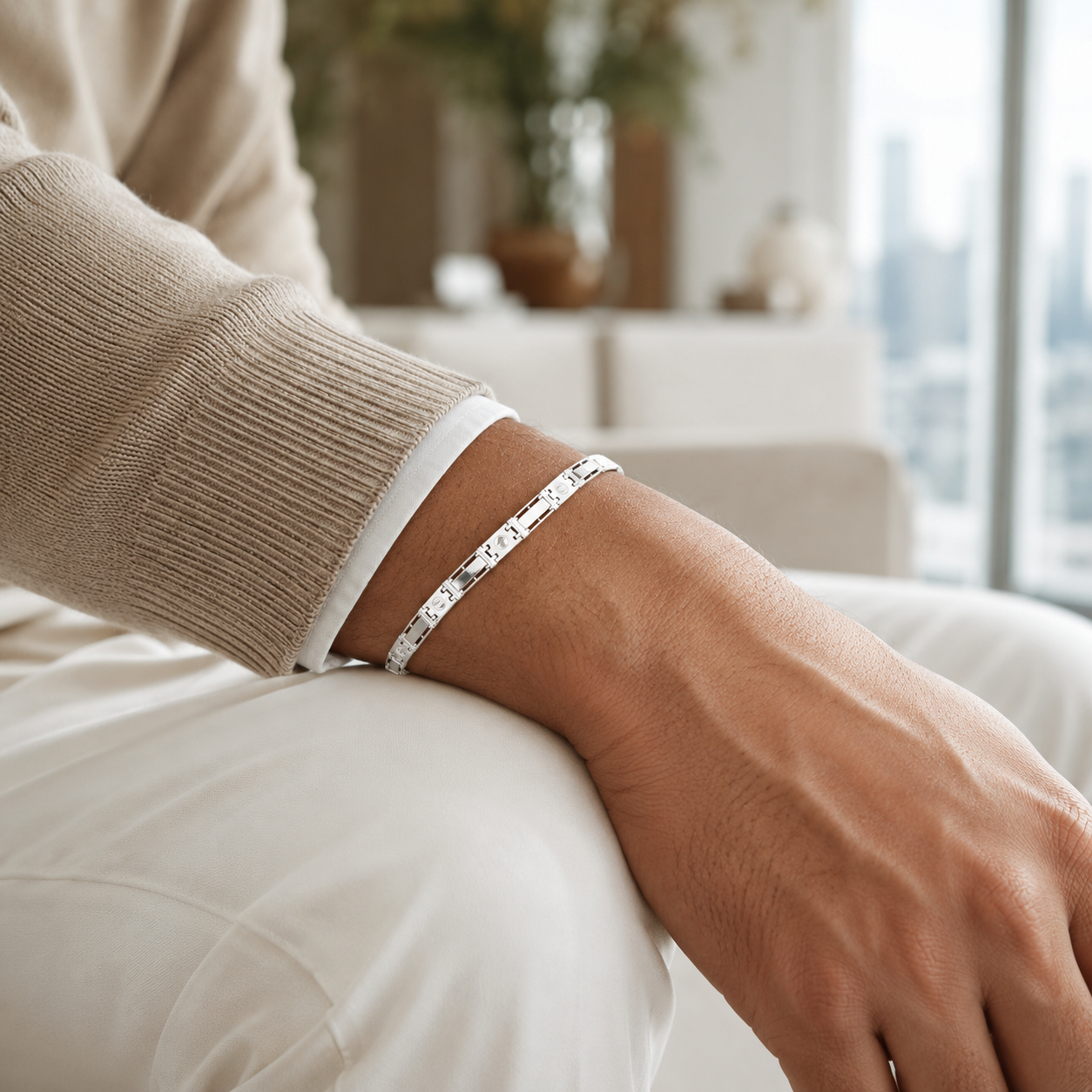 Close-up of the sterling silver link bracelet highlighting the engraved screw-head designs.