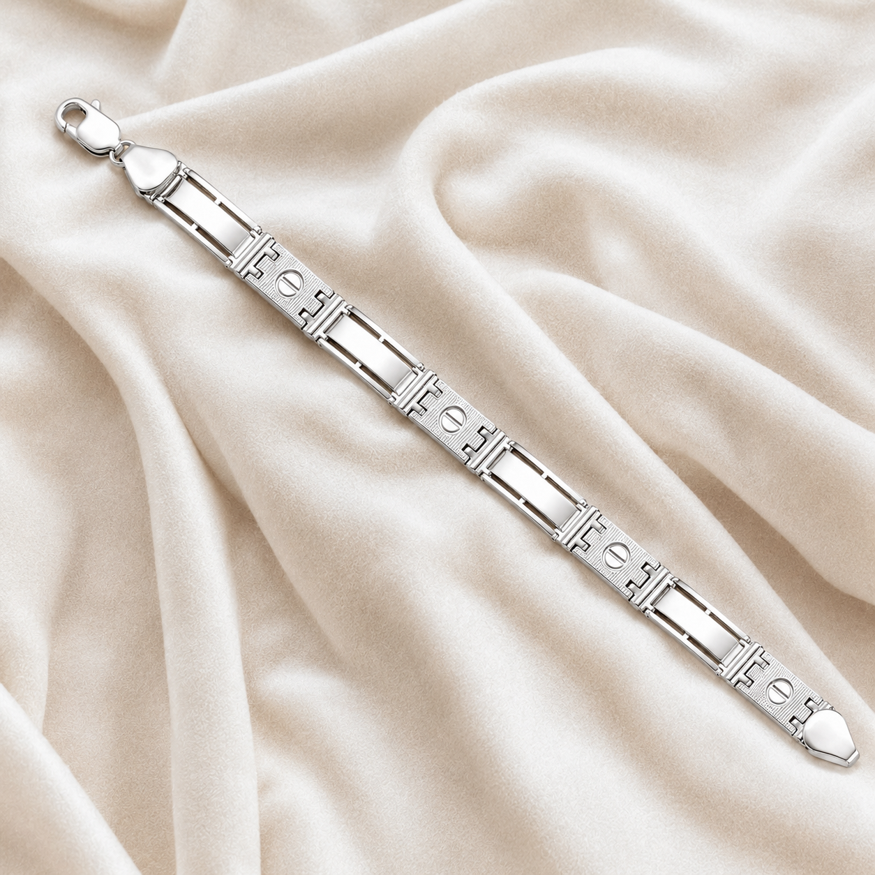Angled view of the silver screw motif bracelet displaying the secure lobster claw clasp.