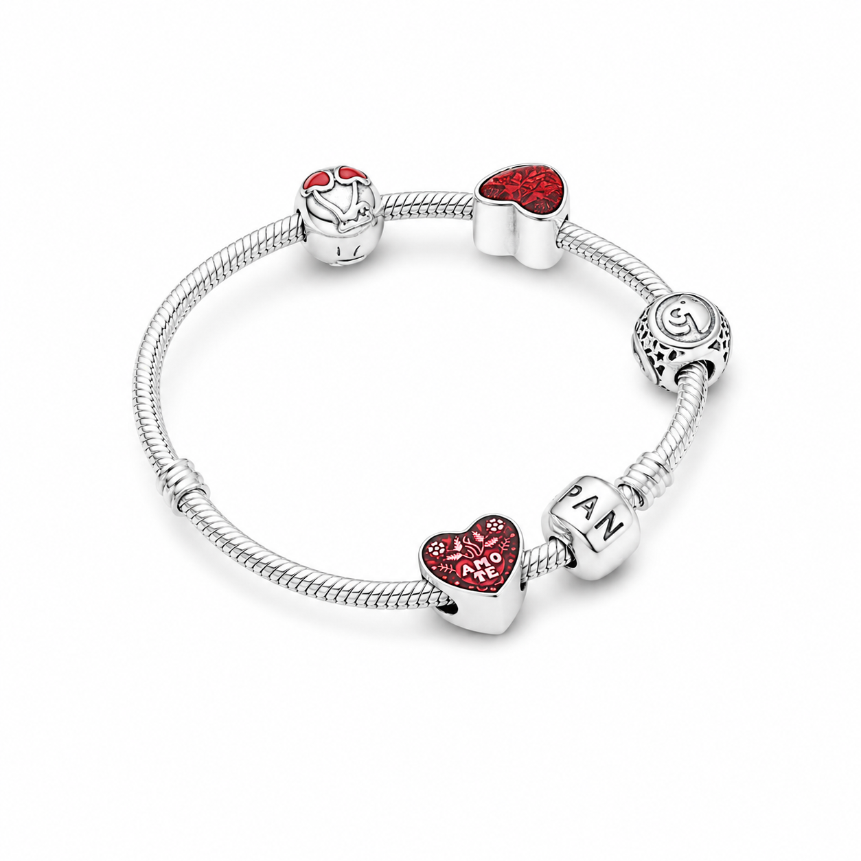 Sterling silver snake chain bracelet laid flat showing red crystal and enamel heart charms.