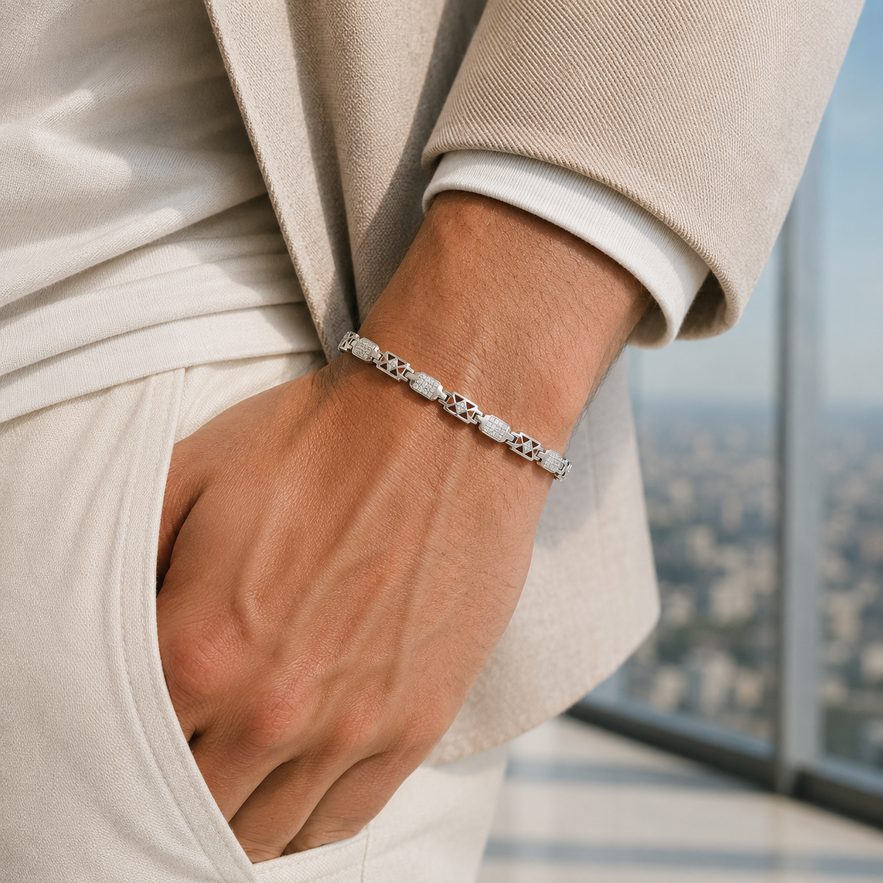 Close-up of the silver link bracelet showing the intricate textured details and sturdy lobster claw clasp
