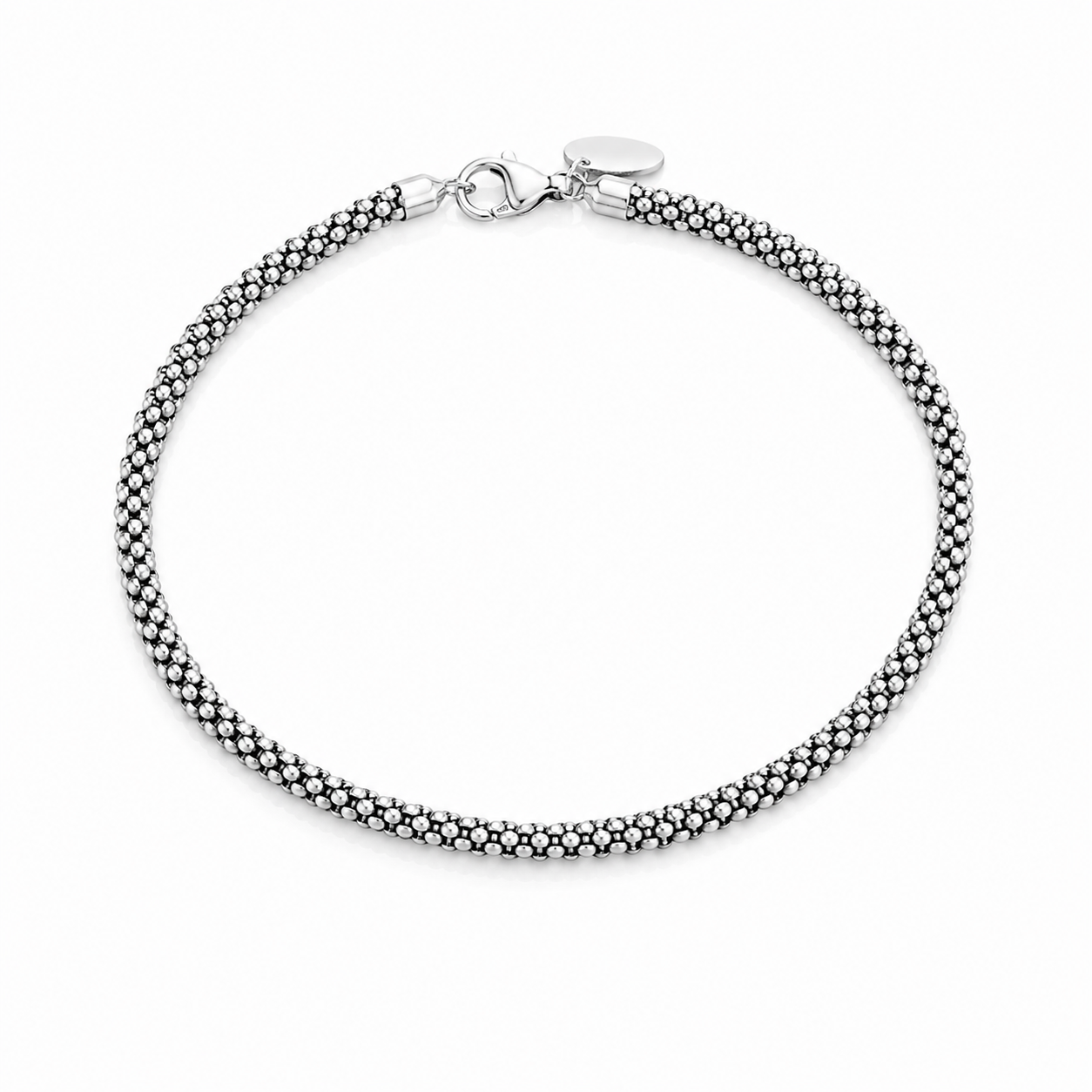 Top-down view of the textured mesh pattern sterling silver anklet arranged in a neat circle against a white background.