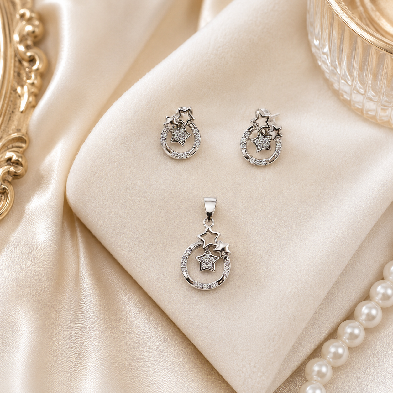 Close-up of the Twinkling Star Halo silver earrings and pendant with stone embellishments.