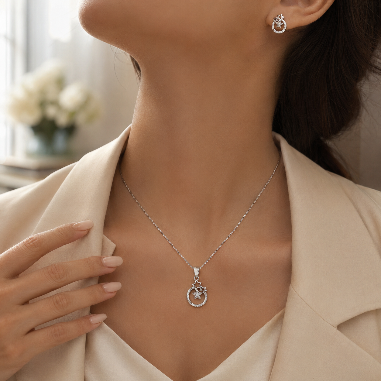 Celestial-themed silver jewelry set with matching star and halo motif.