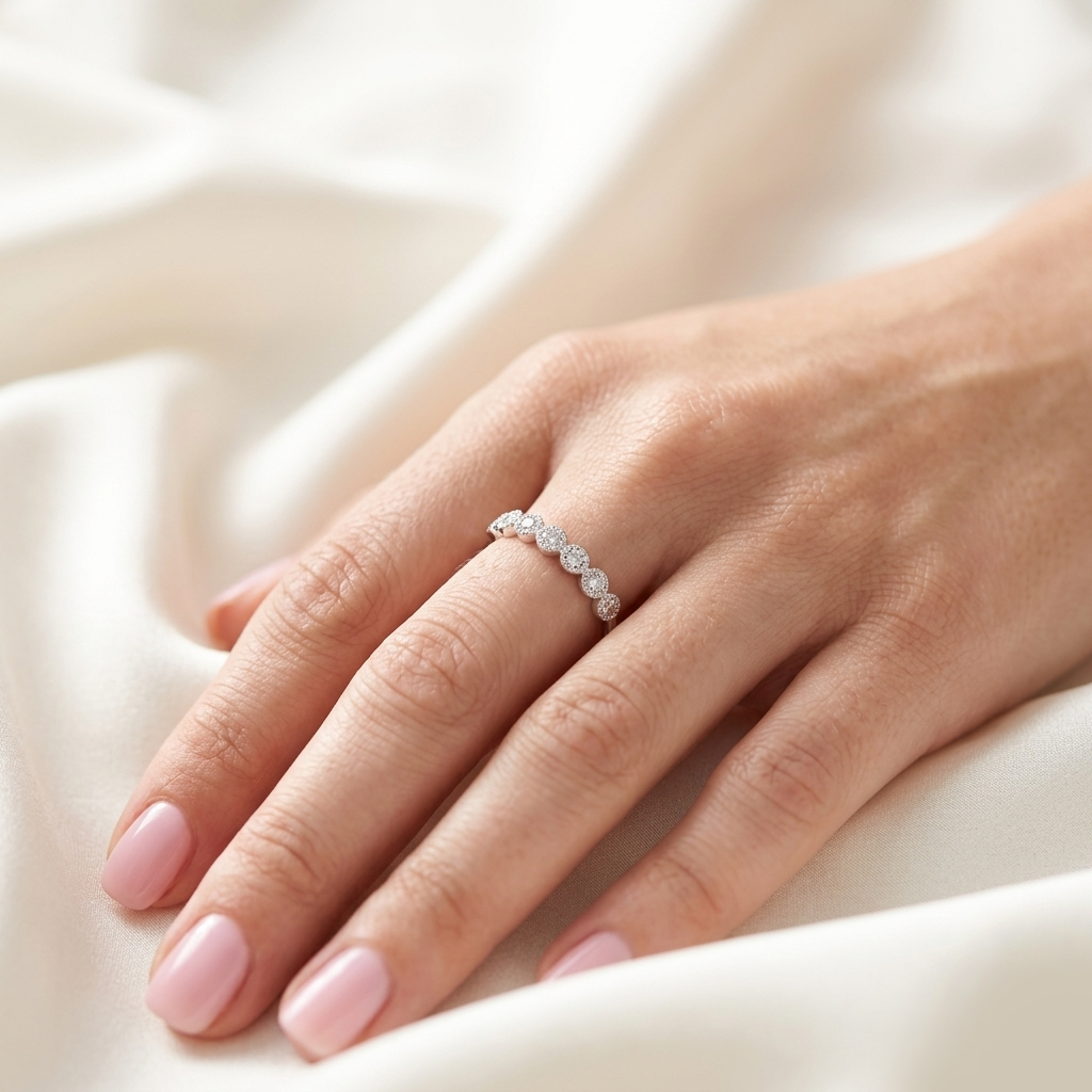 Alternating Halo Sterling Silver Ring worn on a woman's hand resting gracefully on a white silk cloth.